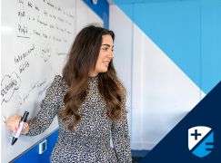 Teacher Annmarie Sheahan in front of whiteboard