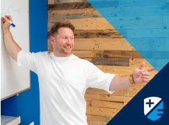 Teacher Matt Curran in front of whiteboard