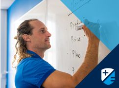 Teacher Barry Drumm in front of whiteboard