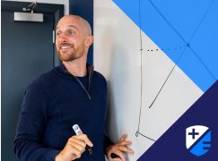 Teacher Barry Drumm in front of whiteboard