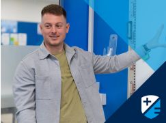 Teacher Seadhan Perry in front of whiteboard