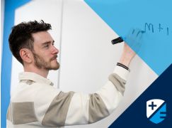 Teacher Kevin Fitzpatrick in front of whiteboard