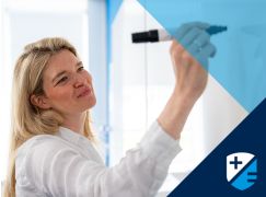 Teacher Seanagh Fallon writing on a whiteboard