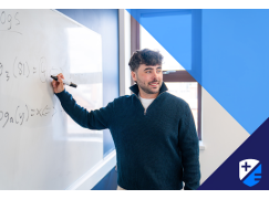 Teacher David Langley writing on whiteboard
